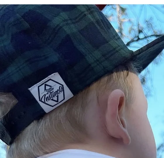 Little Instincts hat label